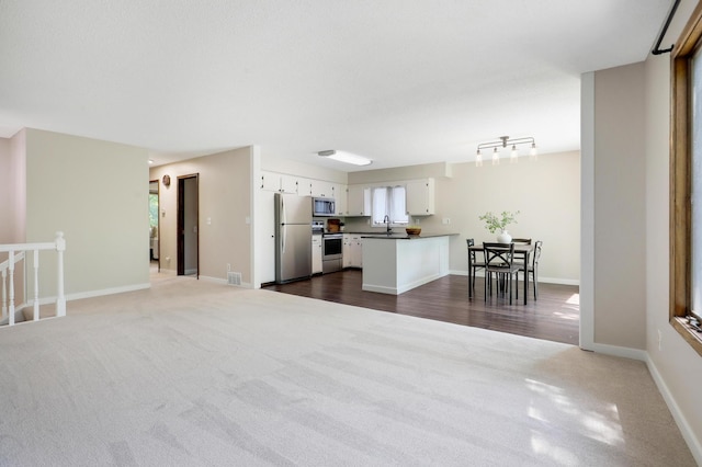 16503 Franklin Trl SE, Prior Lake, MN 55372 - living area featuring dark carpet and baseboards