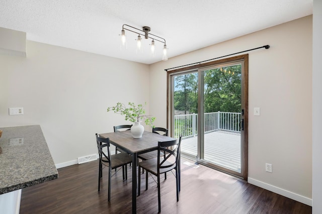 16503 Franklin Trl SE, Prior Lake, MN 55372 - dining area with dark wood-style floors, baseboards, and track lighting