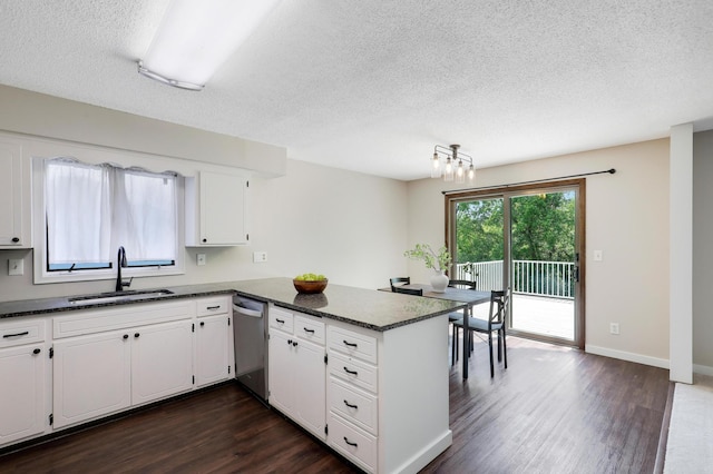 16503 Franklin Trl SE, Prior Lake, MN 55372 - kitchen with stainless steel dishwasher, a sink, dark wood finished floors, a peninsula, and a textured ceiling