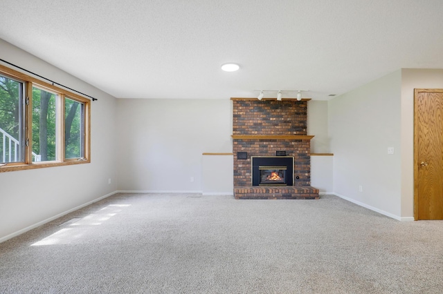 16503 Franklin Trl SE, Prior Lake, MN 55372 - unfurnished living room with carpet floors, a brick fireplace, rail lighting, and baseboards