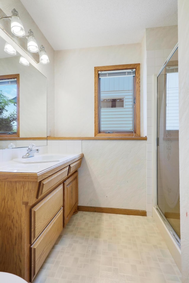 16503 Franklin Trl SE, Prior Lake, MN 55372 - bathroom with vanity, a shower stall, and baseboards
