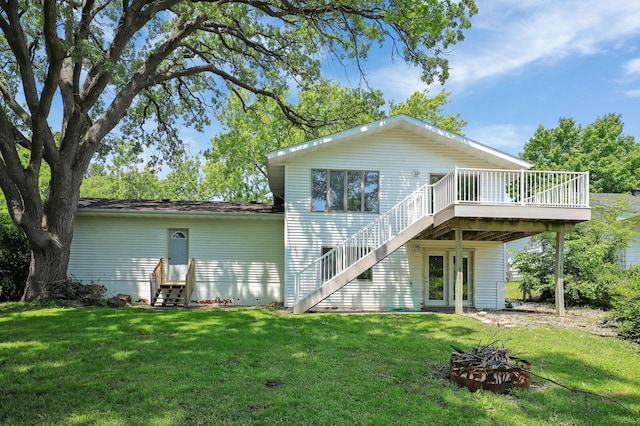 16503 Franklin Trl SE, Prior Lake, MN 55372 - rear view of property with entry steps, a wooden deck, and a lawn