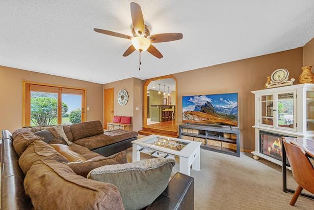 1525 21st Ave NW, Faribault, MN 55021 - carpeted living room with ceiling fan and a chandelier