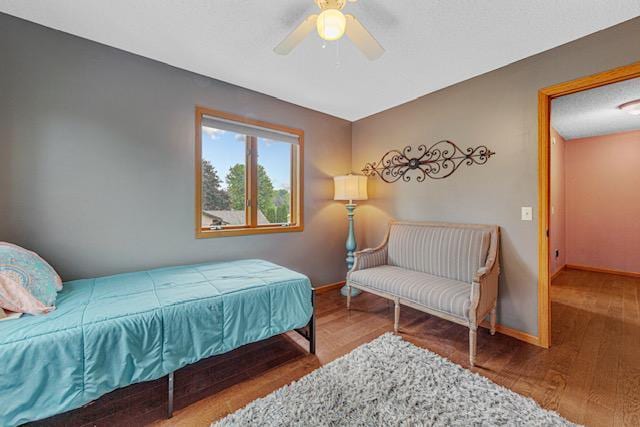 1525 21st Ave NW, Faribault, MN 55021 - bedroom featuring wood finished floors, baseboards, and a ceiling fan