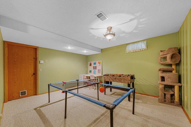 1525 21st Ave NW, Faribault, MN 55021 - playroom with carpet flooring, baseboards, and recessed lighting
