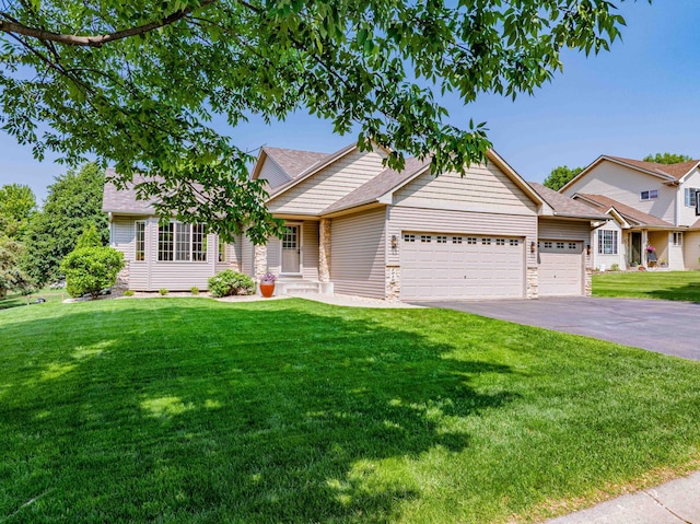 1918 Silver St, Waconia, MN 55387 - view of front of house featuring a garage, a front yard, driveway, and roof with shingles