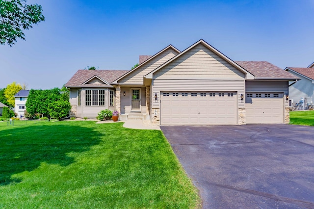 1918 Silver St, Waconia, MN 55387 - view of front of property featuring an attached garage, asphalt driveway, a chimney, and a front yard
