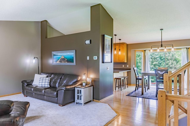 1918 Silver St, Waconia, MN 55387 - living room with baseboards, light wood finished floors, and vaulted ceiling