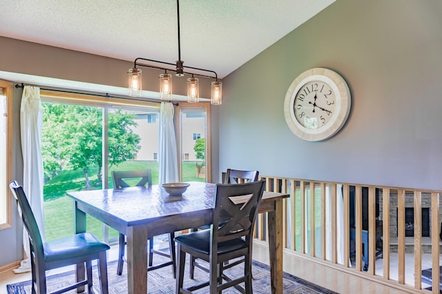 1918 Silver St, Waconia, MN 55387 - dining space featuring a textured ceiling and lofted ceiling