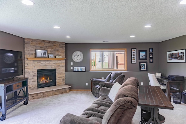 1918 Silver St, Waconia, MN 55387 - carpeted living area featuring a textured ceiling, recessed lighting, and a stone fireplace