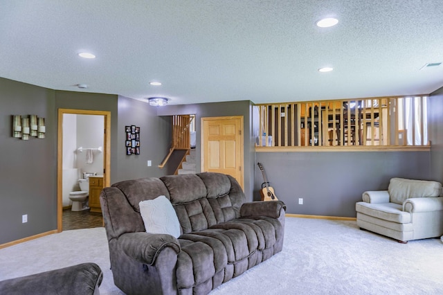 1918 Silver St, Waconia, MN 55387 - carpeted living room with a textured ceiling, recessed lighting, stairs, and baseboards