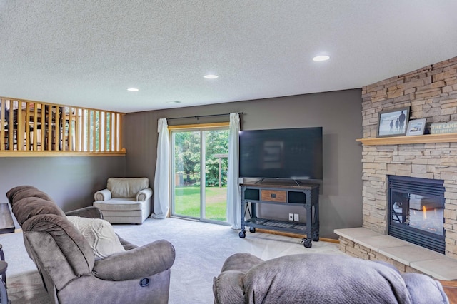 1918 Silver St, Waconia, MN 55387 - living area featuring a textured ceiling, carpet, a stone fireplace, and recessed lighting