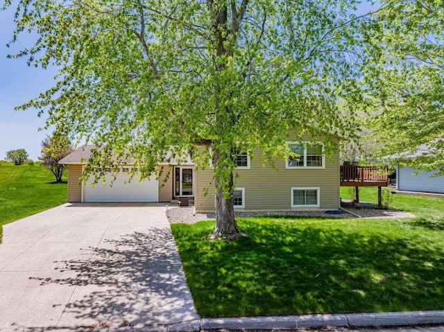 319 Casper Cir, Norwood Young America, MN 55368 - view of front facade with driveway, a front yard, an attached garage, and a wooden deck