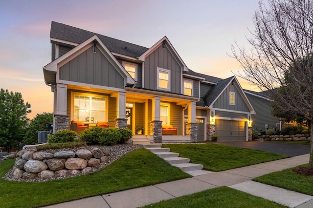 16632 Early Dawn Trl, Lakeville, MN 55044 - craftsman house with board and batten siding, covered porch, stone siding, and asphalt driveway