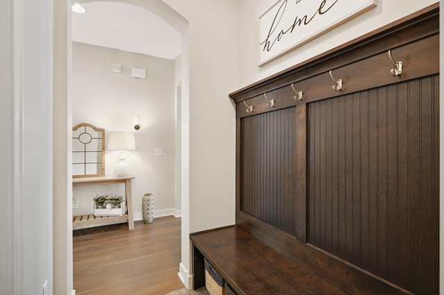 16632 Early Dawn Trl, Lakeville, MN 55044 - mudroom featuring wood finished floors, baseboards, and arched walkways