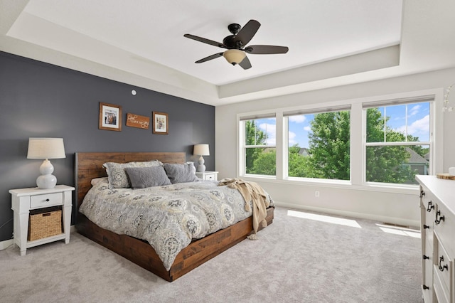 16632 Early Dawn Trl, Lakeville, MN 55044 - bedroom with a tray ceiling, light colored carpet, baseboards, and ceiling fan