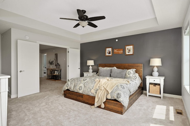 16632 Early Dawn Trl, Lakeville, MN 55044 - bedroom with carpet floors, baseboards, a ceiling fan, and a tray ceiling
