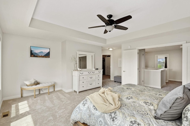 16632 Early Dawn Trl, Lakeville, MN 55044 - bedroom with light carpet, baseboards, and a tray ceiling