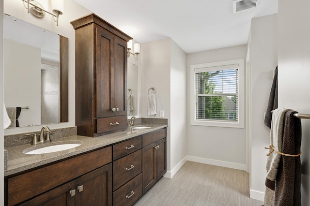 16632 Early Dawn Trl, Lakeville, MN 55044 - bathroom with double vanity and baseboards