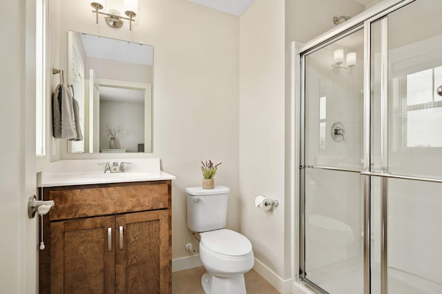 16632 Early Dawn Trl, Lakeville, MN 55044 - bathroom with toilet, vanity, a stall shower, and baseboards