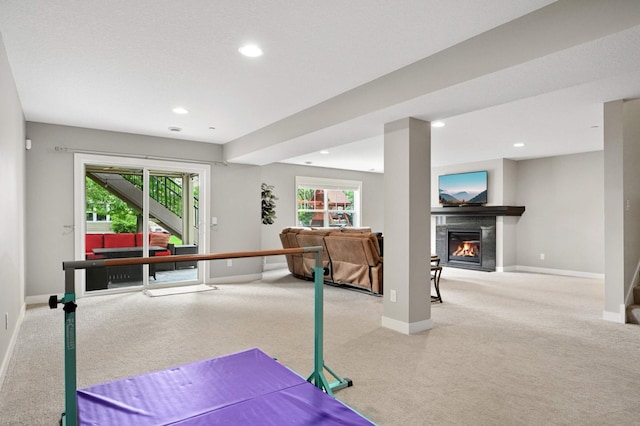 16632 Early Dawn Trl, Lakeville, MN 55044 - playroom featuring carpet flooring, baseboards, healthy amount of natural light, a glass covered fireplace, and recessed lighting