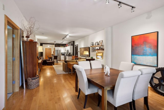 401 2nd St Unit 208, Minneapolis, MN 55401 - dining room with rail lighting and light wood-style floors