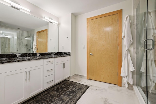 401 2nd St Unit 208, Minneapolis, MN 55401 - bathroom featuring marble finish flooring, double vanity, and a marble finish shower