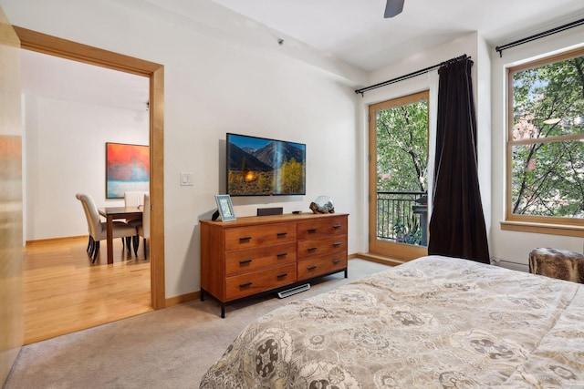 401 2nd St Unit 208, Minneapolis, MN 55401 - bedroom with access to outside, carpet flooring, and a baseboard heating unit