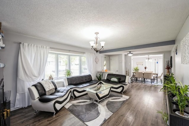 2575 Quebec Ave S, Saint Louis Park, MN 55426 - living room featuring a chandelier, dark wood-type flooring, and a textured ceiling