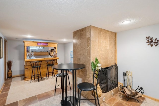 2575 Quebec Ave S, Saint Louis Park, MN 55426 - indoor dry bar featuring recessed lighting, a textured ceiling, and baseboards