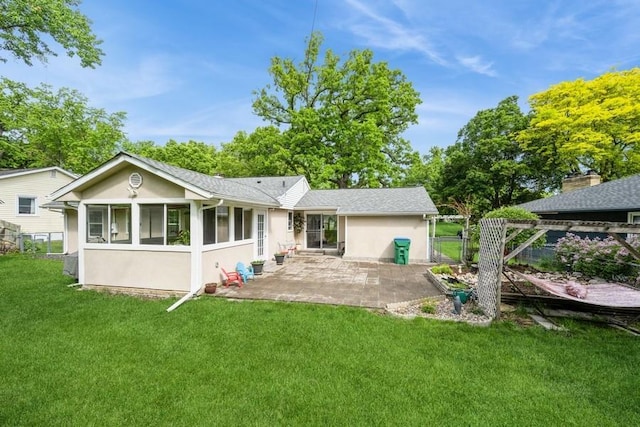 2575 Quebec Ave S, Saint Louis Park, MN 55426 - rear view of property featuring stucco siding, a patio, and a sunroom