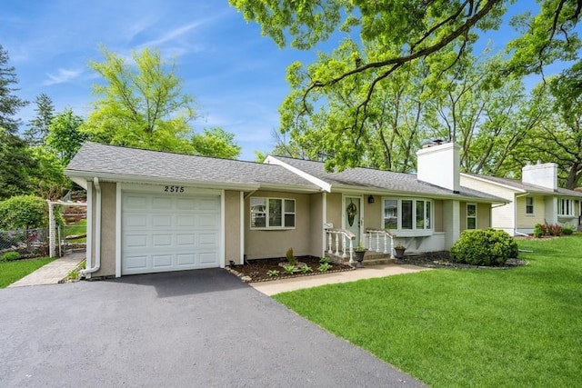 2575 Quebec Ave S, Saint Louis Park, MN 55426 - single story home featuring asphalt driveway, an attached garage, a chimney, and stucco siding
