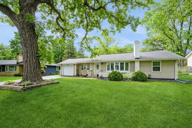 2575 Quebec Ave S, Saint Louis Park, MN 55426 - view of front of home featuring a chimney, an attached garage, a front lawn, and driveway