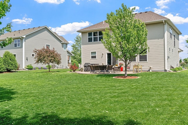 14143 Ailesbury Ave, Rosemount, MN 55068 - back of house featuring a patio, a yard, and roof with shingles