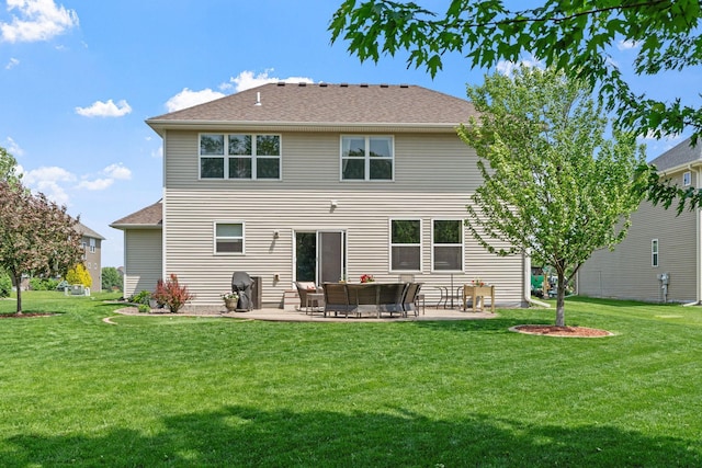 14143 Ailesbury Ave, Rosemount, MN 55068 - rear view of property with a patio area, a yard, and a shingled roof
