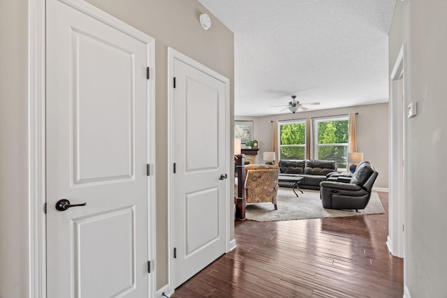 14143 Ailesbury Ave, Rosemount, MN 55068 - hall featuring dark wood finished floors and baseboards