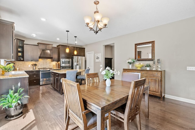 14143 Ailesbury Ave, Rosemount, MN 55068 - dining area featuring a chandelier, wood finished floors, and recessed lighting
