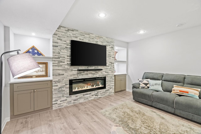 14143 Ailesbury Ave, Rosemount, MN 55068 - living room with wood finished floors, a large fireplace, and recessed lighting