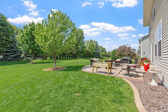 14143 Ailesbury Ave, Rosemount, MN 55068 - view of green lawn featuring a patio area