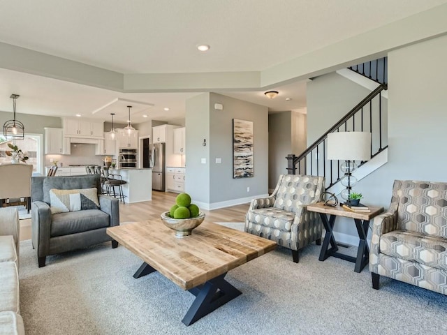 68 143rd Ave NW, Andover, MN 55304 - living area featuring recessed lighting, stairway, baseboards, and light colored carpet