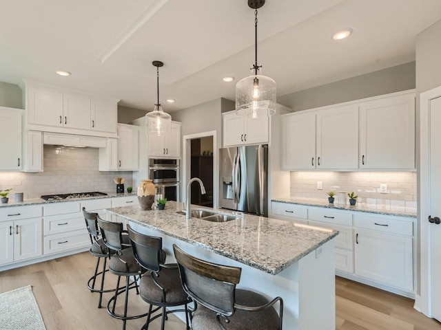 68 143rd Ave NW, Andover, MN 55304 - kitchen with stainless steel appliances, a sink, tasteful backsplash, white cabinetry, and recessed lighting