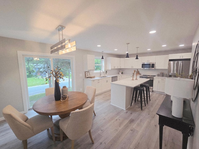 2710 Garden Ln, Mound, MN 55364 - dining room featuring light wood-style flooring and recessed lighting