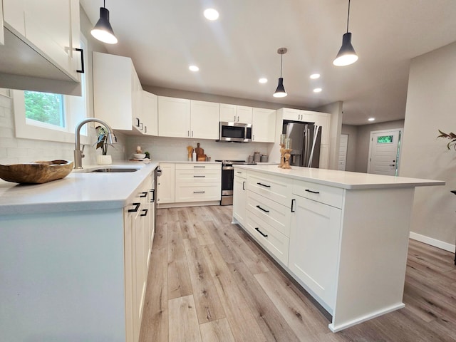 2710 Garden Ln, Mound, MN 55364 - kitchen with appliances with stainless steel finishes, light wood-style flooring, tasteful backsplash, recessed lighting, and white cabinets