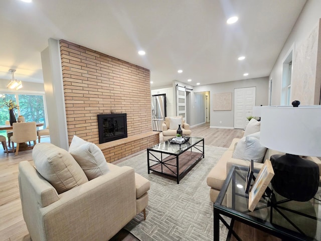 2710 Garden Ln, Mound, MN 55364 - living area with wood finished floors, a fireplace, and recessed lighting