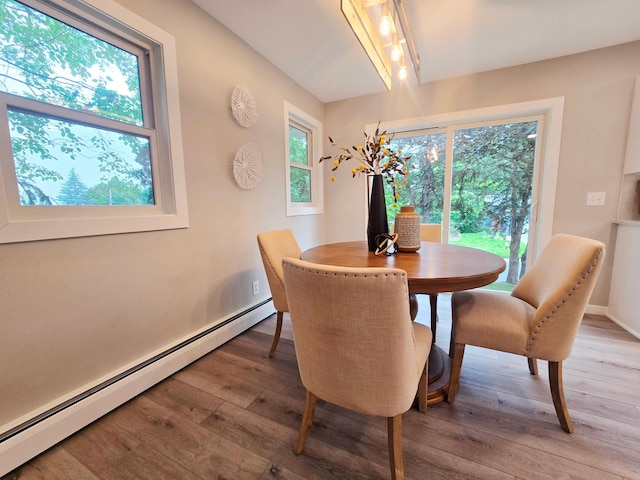 2710 Garden Ln, Mound, MN 55364 - dining room with a baseboard heating unit and light wood finished floors