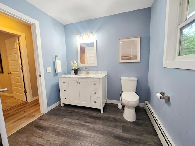 2710 Garden Ln, Mound, MN 55364 - bathroom with a baseboard heating unit, vanity, and wood finished floors