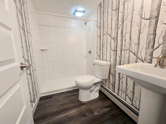 2710 Garden Ln, Mound, MN 55364 - full bathroom featuring a baseboard radiator, tiled shower, and wood finished floors