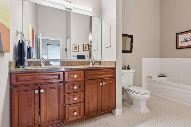 301 Clifton Ave Unit 1K, Minneapolis, MN 55403 - bathroom featuring double vanity, toilet, a garden tub, and tile patterned floors