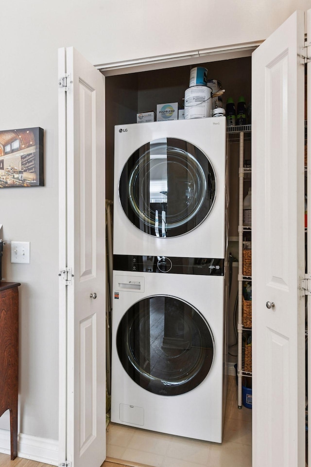 301 Clifton Ave Unit 1K, Minneapolis, MN 55403 - washroom featuring stacked washer / dryer