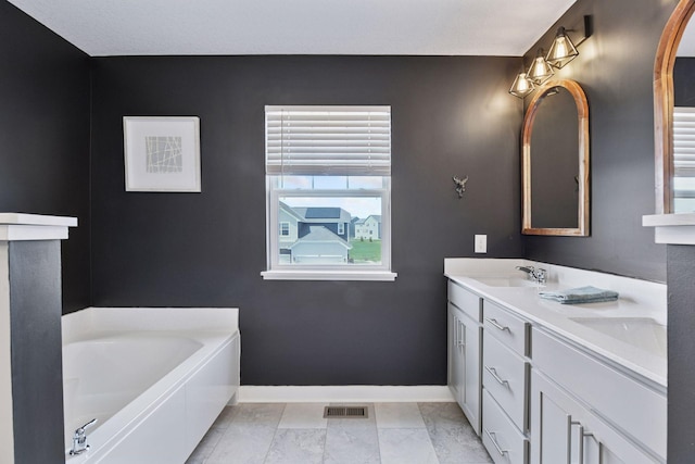 515 Goldenrod Trl, Waconia, MN 55387 - full bath featuring baseboards, double vanity, and a bath